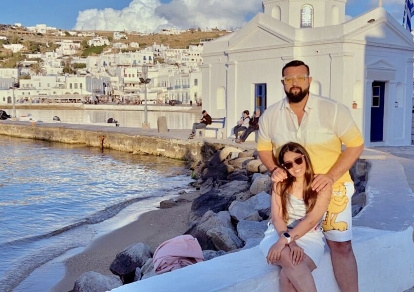 A couple in front of a church in mykonos town