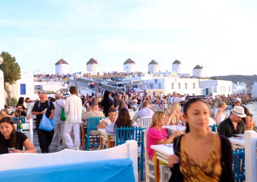 People at the wind mills of Mykonos