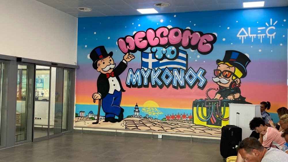 Mykonos airport welcome poster