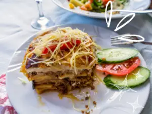 where to eat in Mykonos like a local, Greek Mousaka plate