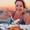 Woman enjoying local greek food.